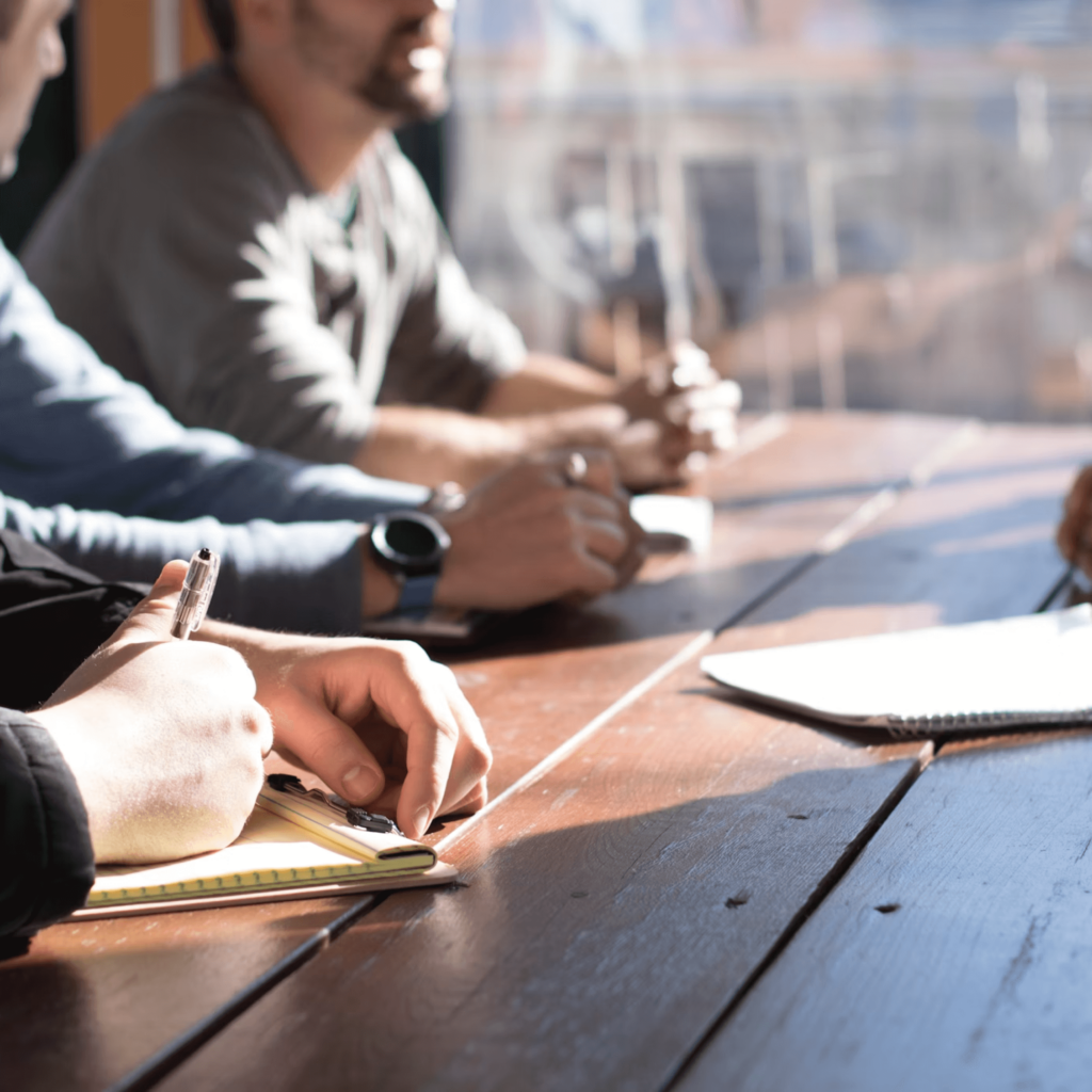 About Us. Lawyers in a meeting.