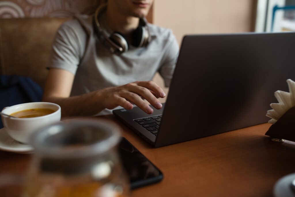 Client referral program. Man on computer referring a new client to Cantor Injury Law.