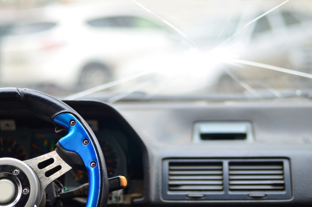 Interior of a car during a traffic accident. Determining A Car Accident Settlement Amount.
